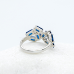 925 Sterling Silver ring with Sapphire September birthstone in emerald cut and prong setting. Baguette ring ideal for special occasions and as personalized gift. Blue Sapphire encourages truth, mental clarity, and spiritual insight. For wisdom, loyalty, focus