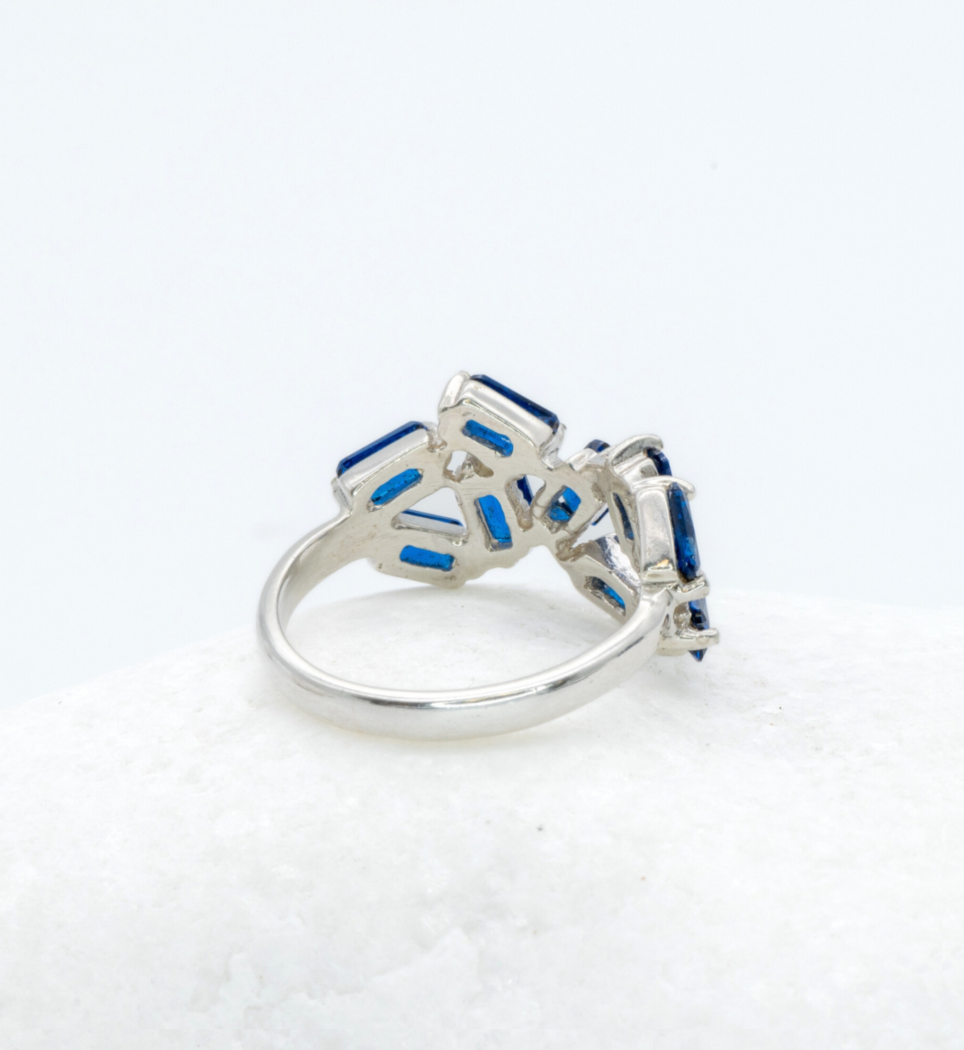 925 Sterling Silver ring with Sapphire September birthstone in emerald cut and prong setting. Baguette ring ideal for special occasions and as personalized gift. Blue Sapphire encourages truth, mental clarity, and spiritual insight. For wisdom, loyalty, focus