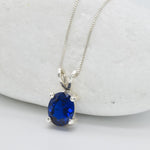 925 Sterling Silver necklace with Sapphire September birthstone in oval cut and prong setting. Solitaire pendant ideal gift for her, and for everyday wear. Blue sapphire pendant encourages truth, mental clarity, and spiritual insight. For wisdom, loyalty, focus