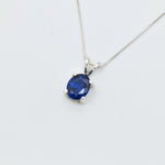 925 Sterling Silver necklace with Sapphire September birthstone in oval cut and prong setting. Blue gemstone pendant ideal as birthday present, and for everyday wear. Solitaire sapphire pendant encourages truth, mental clarity, and spiritual insight. For wisdom, loyalty, focus
