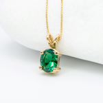 Solitaire Emerald May birthstone Necklace crafted in 18k yellow gold over solid 925 sterling silver. Oval emerald gemstone encourages growth, harmony, and deep emotional healing. Perfect anniversary present, ideal for casual and formal wear.