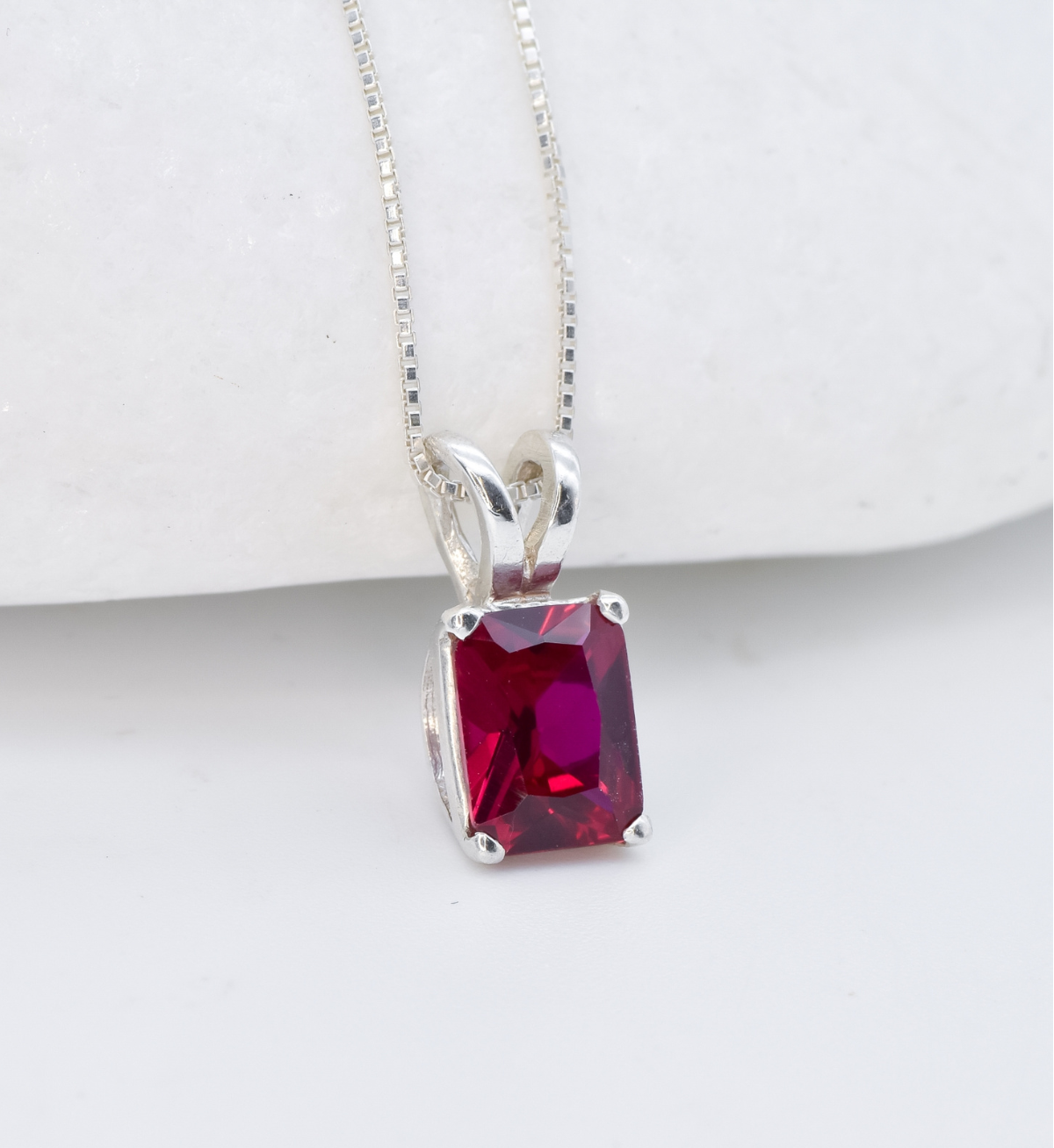 Solitaire Ruby necklace set in solid 925 sterling silver, in a baguette cut, and prong setting. This Square ruby pendant is perfect for special occasions, for layering necklaces or wearing solo. July birthstone necklace boosts confidence, enhances courage, and inspires love and success. 