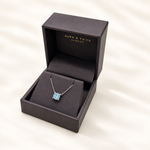 Sky blue topaz pendant necklace presented in Aura and Faith box