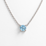 Round sky blue topaz white gold pendant necklace, front view