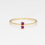 Aura & Faith two-birthstone ring in 14k yellow gold, shown with two rubies