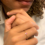 Aura & Faith ruby two-stone ring worn on a hand
