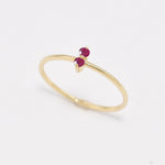 Side view of Aura & Faith dainty two-stone 14k gold ring, shown with rubies