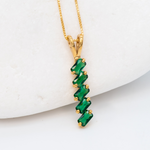 Emerald May birthstone Necklace crafted in 18k Yellow Gold Vermeil over solid 925 sterling silver, in baguette cuts, prong setting, and stunning green color. Vertical necklace perfect for date night or special occasions, and ideal gift for her. Green gemstone pendant encourages growth, harmony, and deep emotional healing.