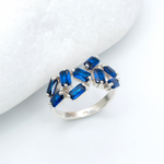 925 Sterling Silver ring with Sapphire September birthstone in emerald cut and prong setting. Statement ring ideal for special occasions and as personalized gift. Sapphire encourages truth, mental clarity, and spiritual insight. For wisdom, loyalty, focus
