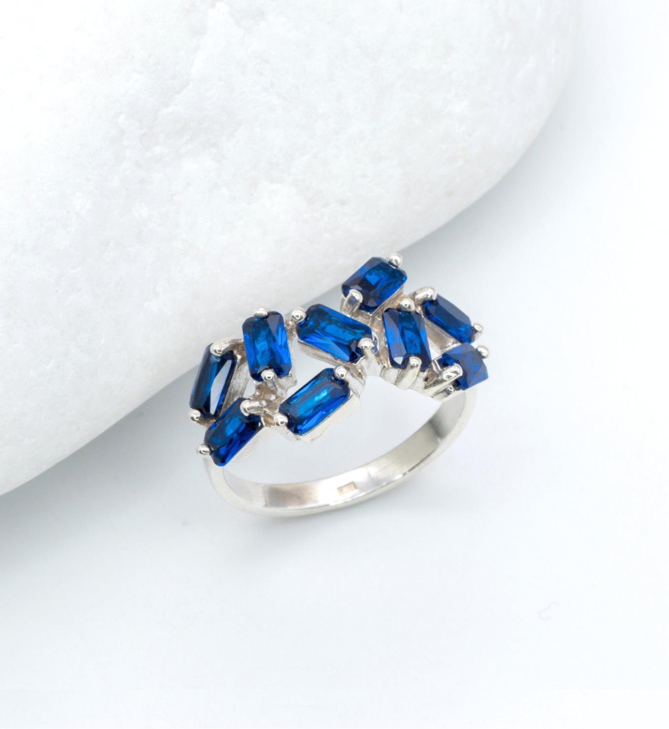 925 Sterling Silver ring with Sapphire September birthstone in emerald cut and prong setting. Statement ring ideal for special occasions and as personalized gift. Sapphire encourages truth, mental clarity, and spiritual insight. For wisdom, loyalty, focus
