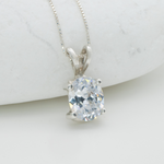 Classic Solitaire Diamond Necklace set in solid 925 sterling silver, April birthstone in an oval cut, and prong setting. Diamond pendant perfect for bridal wear, and special occasions. CZ Diamond symbolizes eternal love, purity, and inner strength. For strength, clarity, abundance