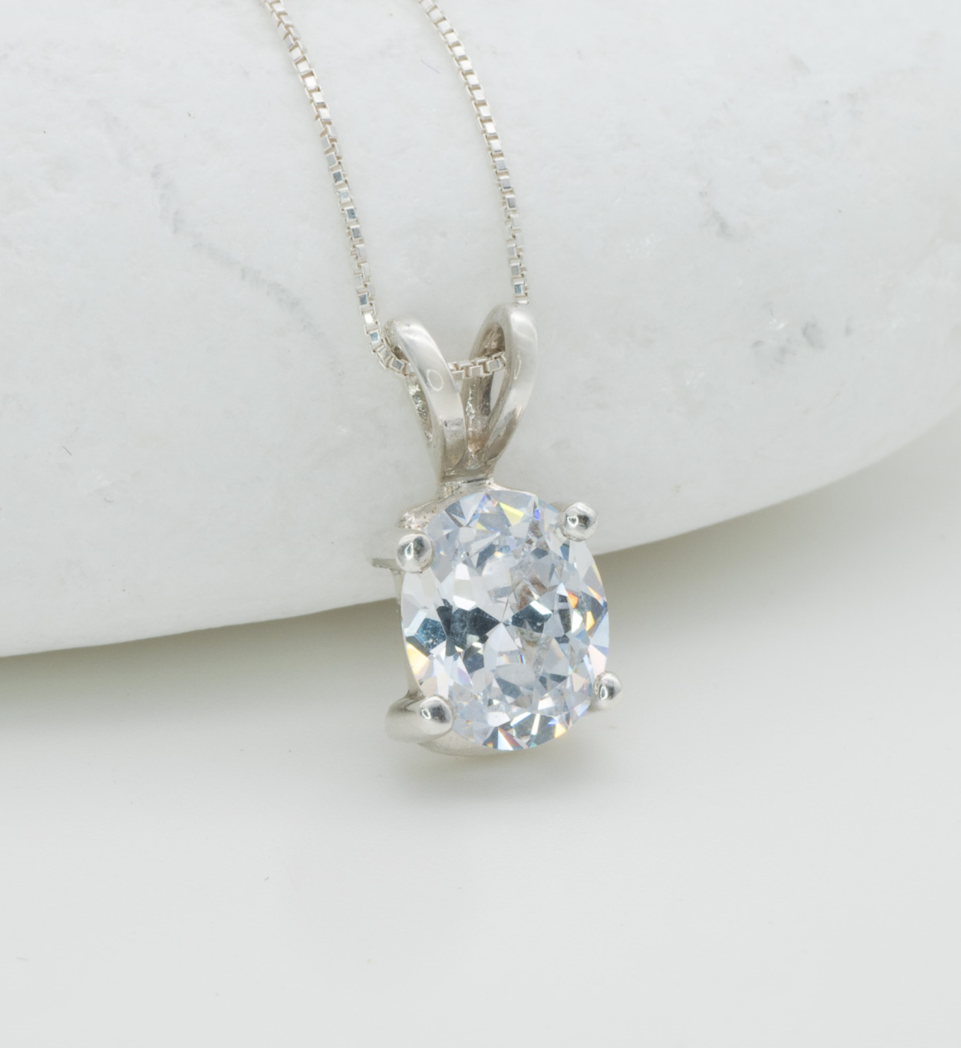 Classic Solitaire Diamond Necklace set in solid 925 sterling silver, April birthstone in an oval cut, and prong setting. Diamond pendant perfect for bridal wear, and special occasions. CZ Diamond symbolizes eternal love, purity, and inner strength. For strength, clarity, abundance