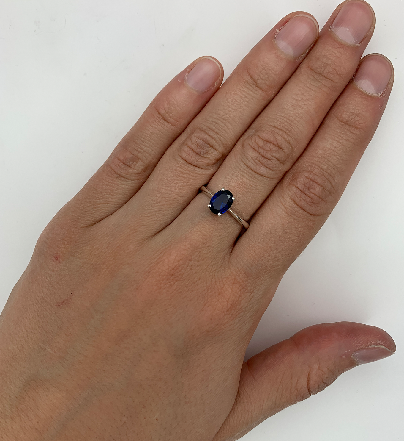 Oval Sapphire Ring worn on middle finger