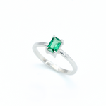 925 Sterling Silver ring with emerald may birthstone in baguette cut and prong setting. Solitaire ring ideal for special occasions and stacking rings. Encourages growth, harmony, and deep emotional healing.