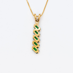 18k Yellow Gold necklace set with emerald may birthstone, in stunning green color, prong setting, and baguette cut. Vertical emerald pendant for her, perfect for date nights, and for special occasions