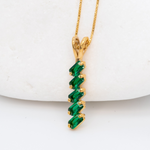 Baguette Emerald May birthstone Pendant crafted in 18k Yellow Gold Vermeil over solid 925 sterling silver, in a prong setting, and stunning green color. Vertical necklace perfect for date night or special occasions, and ideal gift for her. Green gemstone pendant encourages growth, harmony, and deep emotional healing.