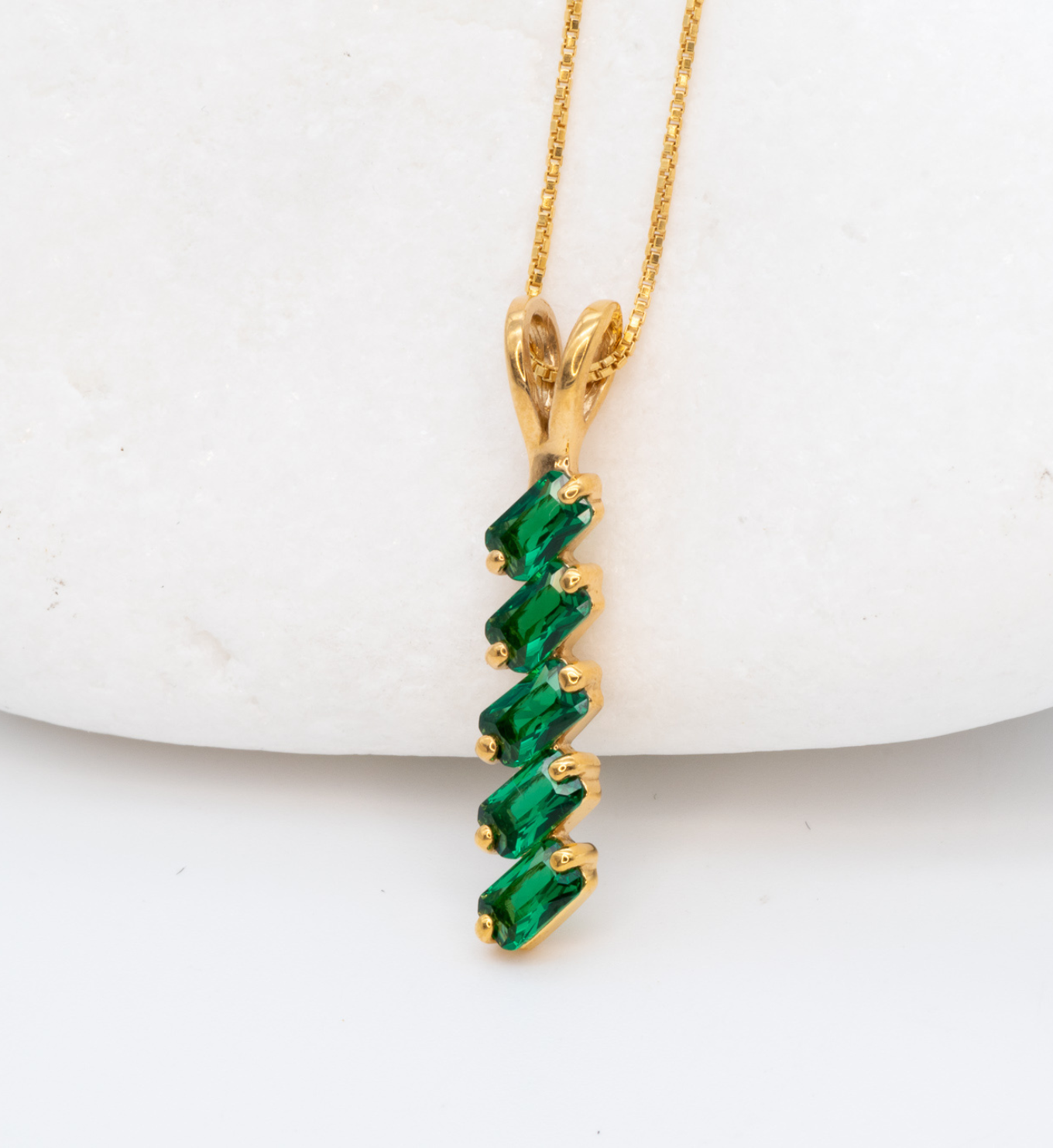 Baguette Emerald May birthstone Pendant crafted in 18k Yellow Gold Vermeil over solid 925 sterling silver, in a prong setting, and stunning green color. Vertical necklace perfect for date night or special occasions, and ideal gift for her. Green gemstone pendant encourages growth, harmony, and deep emotional healing.