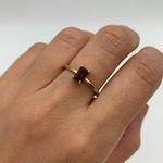 Gold Garnet Ring worn in middle finger