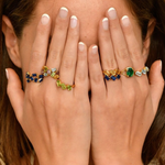 Woman wearing stackable rings, ideal ring stacking style, ring stacking ideas. 925 Sterling Silver ring with real peridot august birthstone in baguette cut and prong setting. Three stone ring ideal for birthday gift and special events. Promotes emotional balance, joy, and clears negative energy. For abundance, healing, protection. How to wear stackable rings