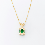 18k Yellow Gold Necklace set with Green Emerald May birthstone. Oval cut emerald gemstone encourages growth, harmony, and deep emotional healing. Solitaire pendant perfect anniversary present, ideal for casual and formal wear.