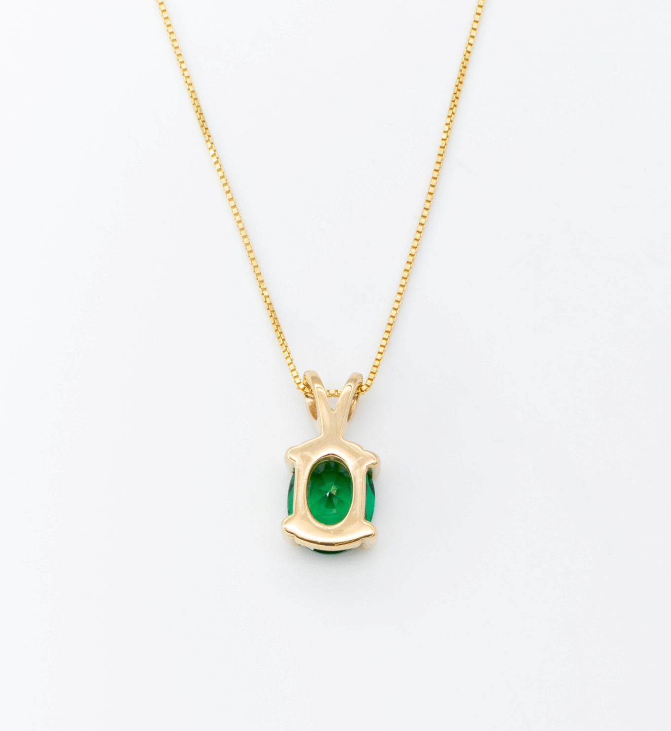 18k Yellow Gold Necklace set with Green Emerald May birthstone. Oval cut emerald gemstone encourages growth, harmony, and deep emotional healing. Solitaire pendant perfect anniversary present, ideal for casual and formal wear.
