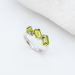 925 Sterling Silver ring with peridot august birthstone in baguette cut and prong setting. Three stone ring ideal for special occasions and personalized gift. Promotes emotional balance, joy, and clears negative energy. For abundance, healing, protection