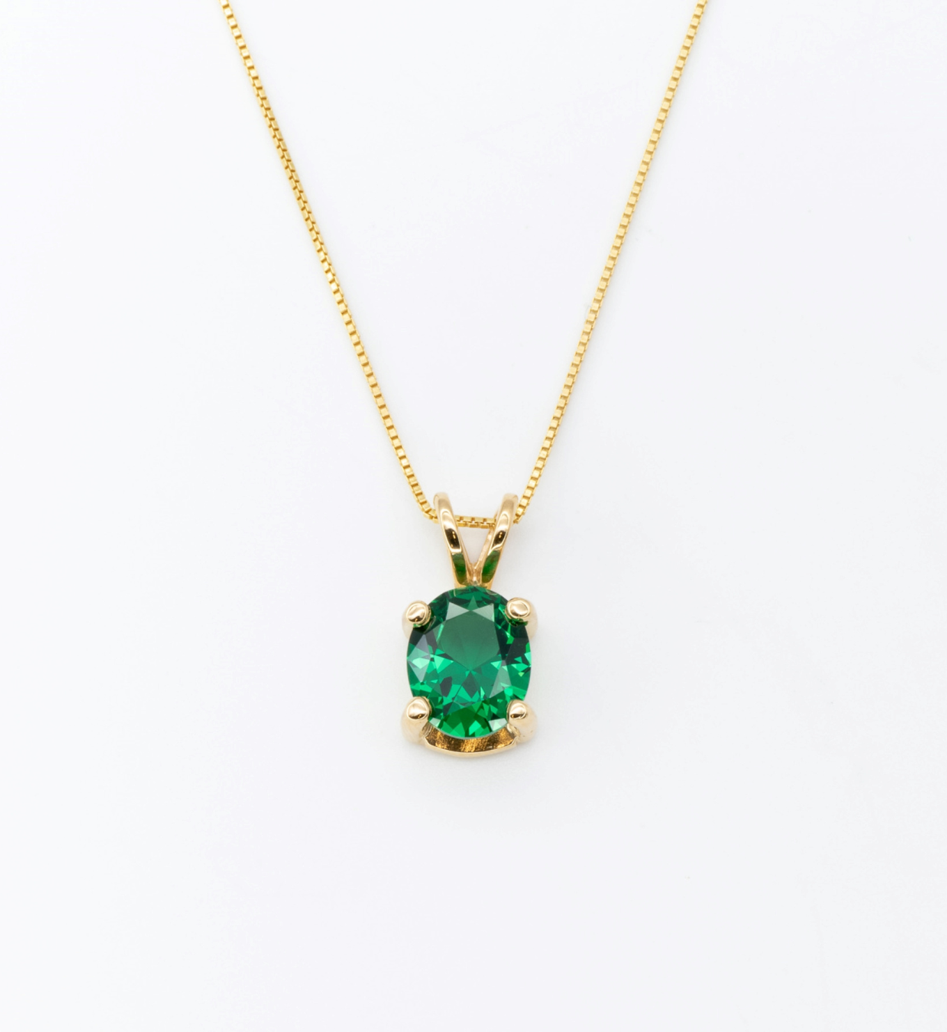 Green Emerald May birthstone Necklace crafted in 18k yellow gold over solid 925 sterling silver. Oval emerald gemstone encourages growth, harmony, and deep emotional healing. Solitaire pendant perfect anniversary present, ideal for casual and formal wear.