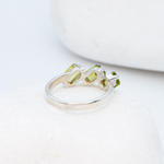 925 Sterling Silver ring with real peridot august birthstone in baguette cut and prong setting. Natural gemstone ring ideal for special occasions and personalized gift. Promotes emotional balance, joy, and clears negative energy. For abundance, healing, protection