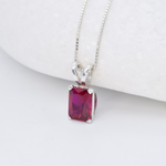 Red Ruby necklace set in solid 925 sterling silver, in a baguette cut, and prong setting. This Solitaire ruby pendant is perfect for special occasions, for layering necklaces or wearing solo. Square ruby necklace boosts confidence, enhances courage, and inspires love and success. For passion, protection, vitality