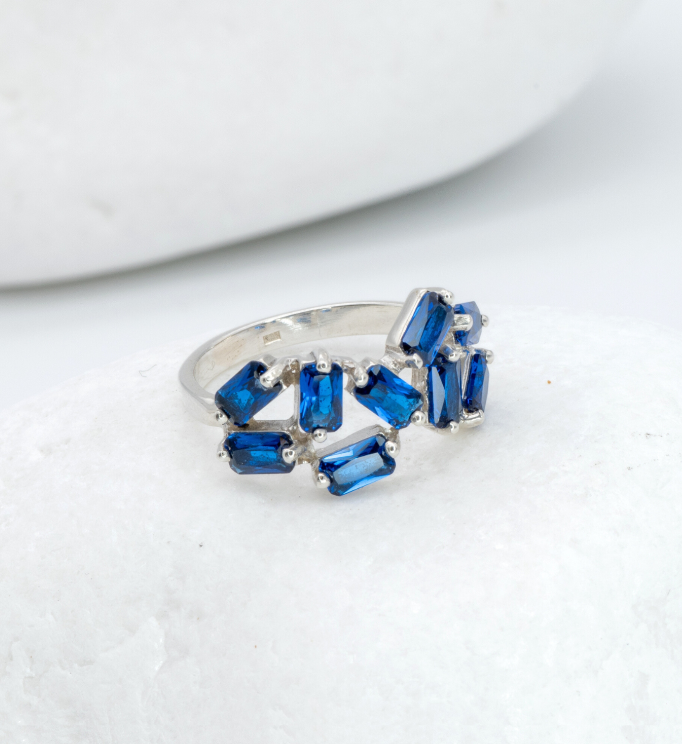 925 Sterling Silver ring with Sapphire September birthstone in emerald cut and prong setting. Handcrafted silver sapphire ring ideal for special occasions and as personalized gift. Sapphire encourages truth, mental clarity, and spiritual insight. For wisdom, loyalty, focus
