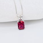 Red Ruby July birthstone necklace set in solid 925 sterling silver, in a baguette cut, and prong setting. This Solitaire ruby pendant is perfect for special occasions, for layering necklaces or wearing solo. Square ruby necklace boosts confidence, enhances courage, and inspires love and success. For passion, protection, vitality
