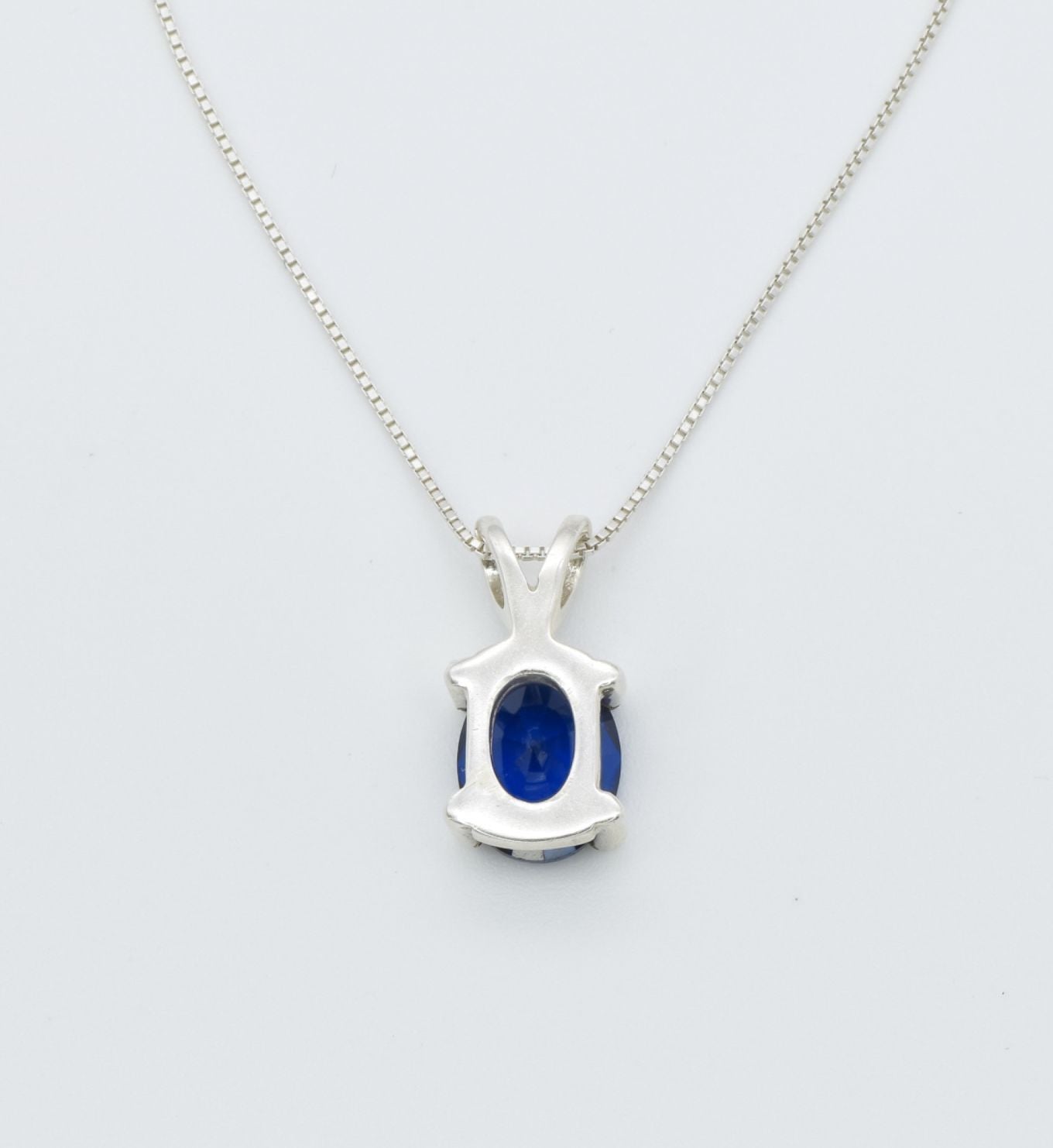 925 Sterling Silver necklace with Sapphire September birthstone in oval cut and prong setting. Solitaire pendant ideal gift for her, and for everyday wear. Blue sapphire pendant encourages truth, mental clarity, and spiritual insight. For wisdom, loyalty, focus
