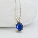 925 Sterling Silver necklace with Sapphire September birthstone in oval cut and prong setting. Blue solitaire pendant ideal gift for her, and for everyday wear. Solitaire sapphire pendant encourages truth, mental clarity, and spiritual insight. For wisdom, loyalty, focus.