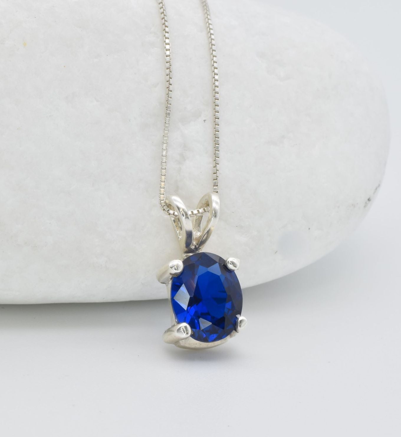 925 Sterling Silver necklace with Sapphire September birthstone in oval cut and prong setting. Blue solitaire pendant ideal gift for her, and for everyday wear. Solitaire sapphire pendant encourages truth, mental clarity, and spiritual insight. For wisdom, loyalty, focus.